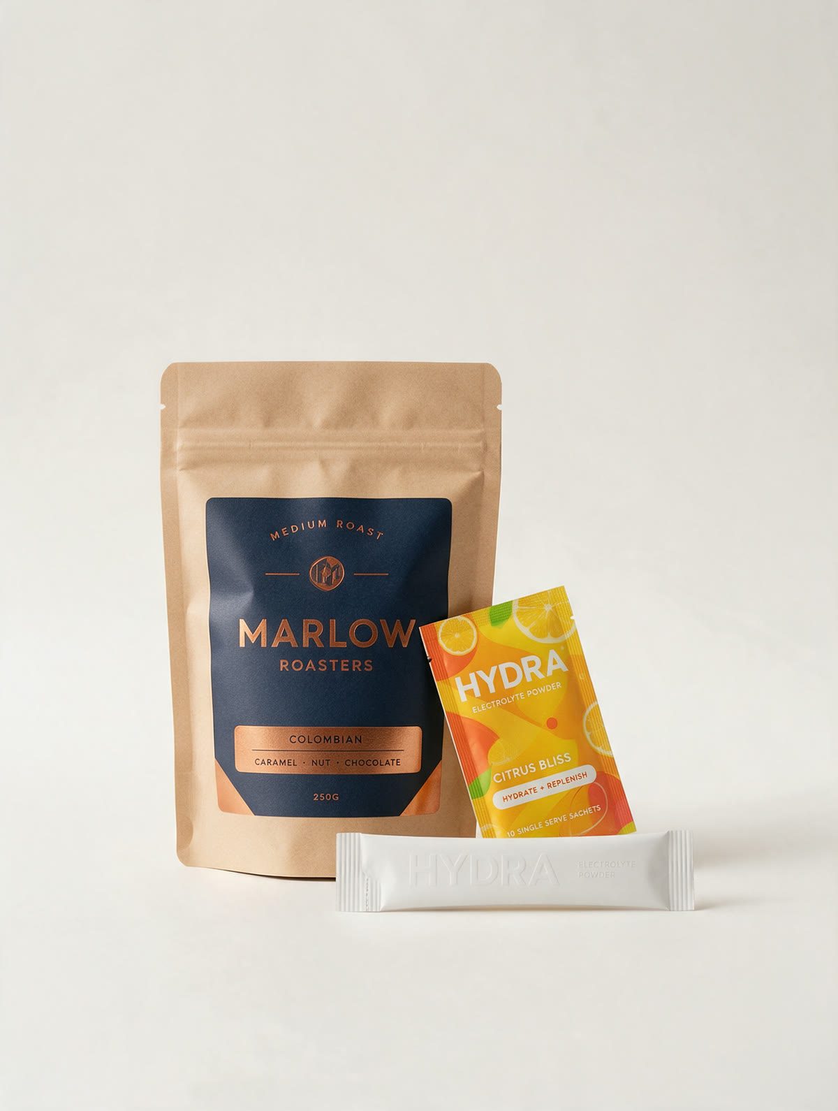 A Marlow Roasters coffee pouch, a Hydra electrolyte sachet and a stickpack